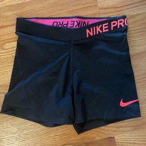 Pink and black Nike pro spandex shorts